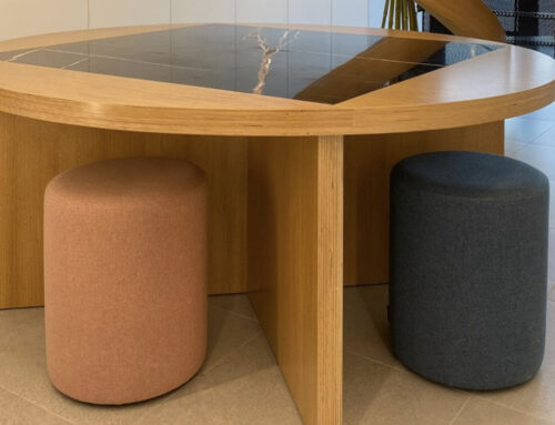 Round wooden table with black marble inlay